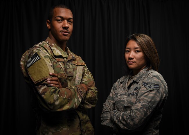 Staff Sgt. Dondre Wood and Airman 1st Class Korie Morimoto, 823rd Maintenance Squadron aircraft fuels systems maintainers, pose for a portrait at Nellis Air Force Base, Nev, Oct. 3, 2017. The Airmen's quick actions resulted in safely evacuating attendees during the Las Vegas shooting that occurred Oct. 1, 2017.