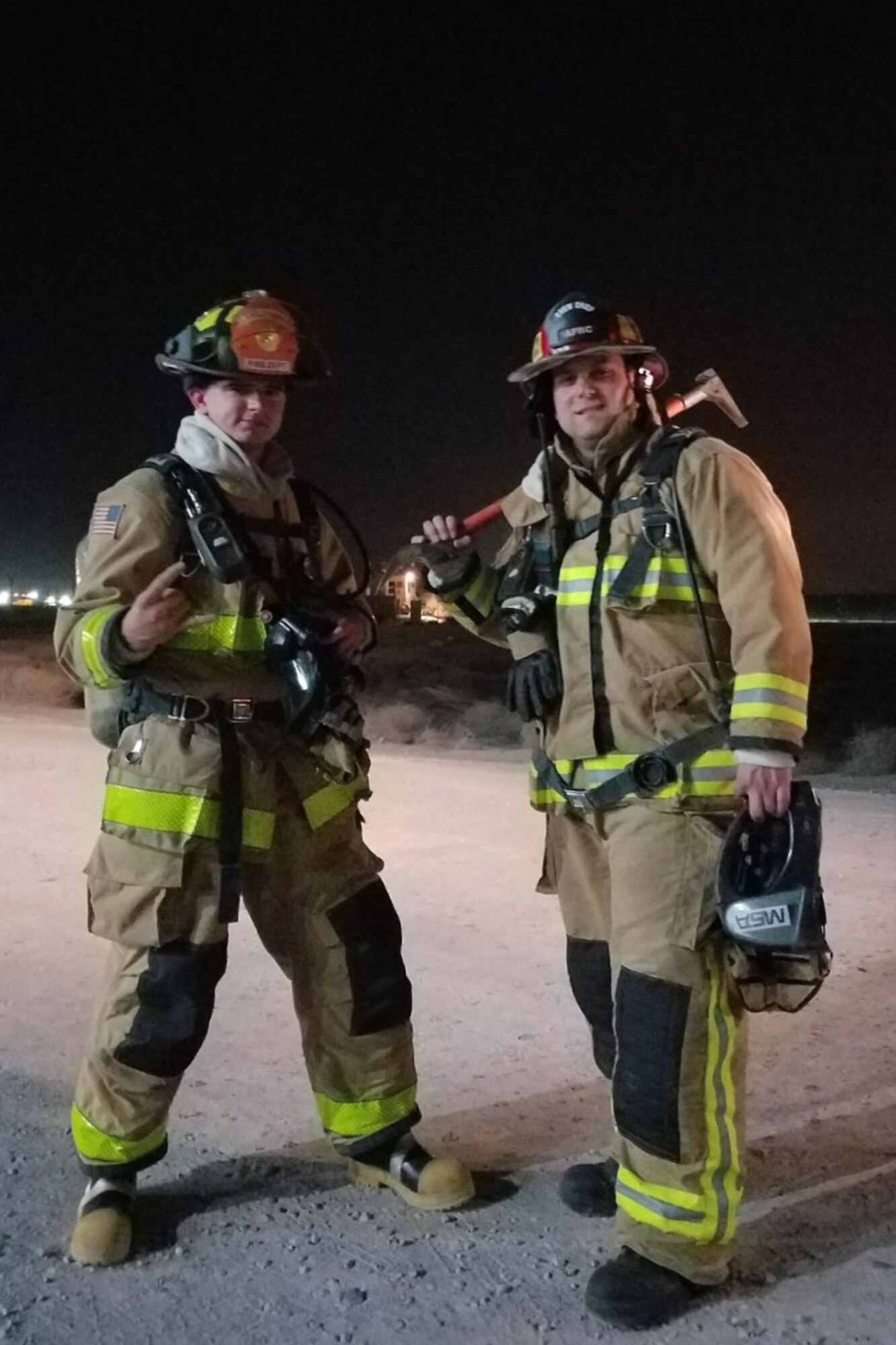 Tech. Sgt Mark McKunes (right) poses for a picture with a fellow firefighter recently at an undisclosed location. McKune is deployed from the 439th Airlift Wing, Westover Air Reserve Base, Massachusetts.