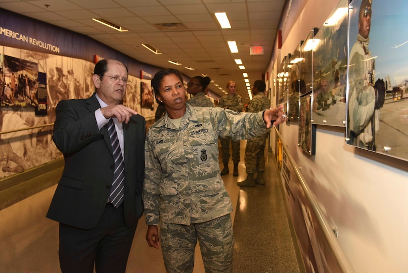 Civilian and airman tour new National Guard display.