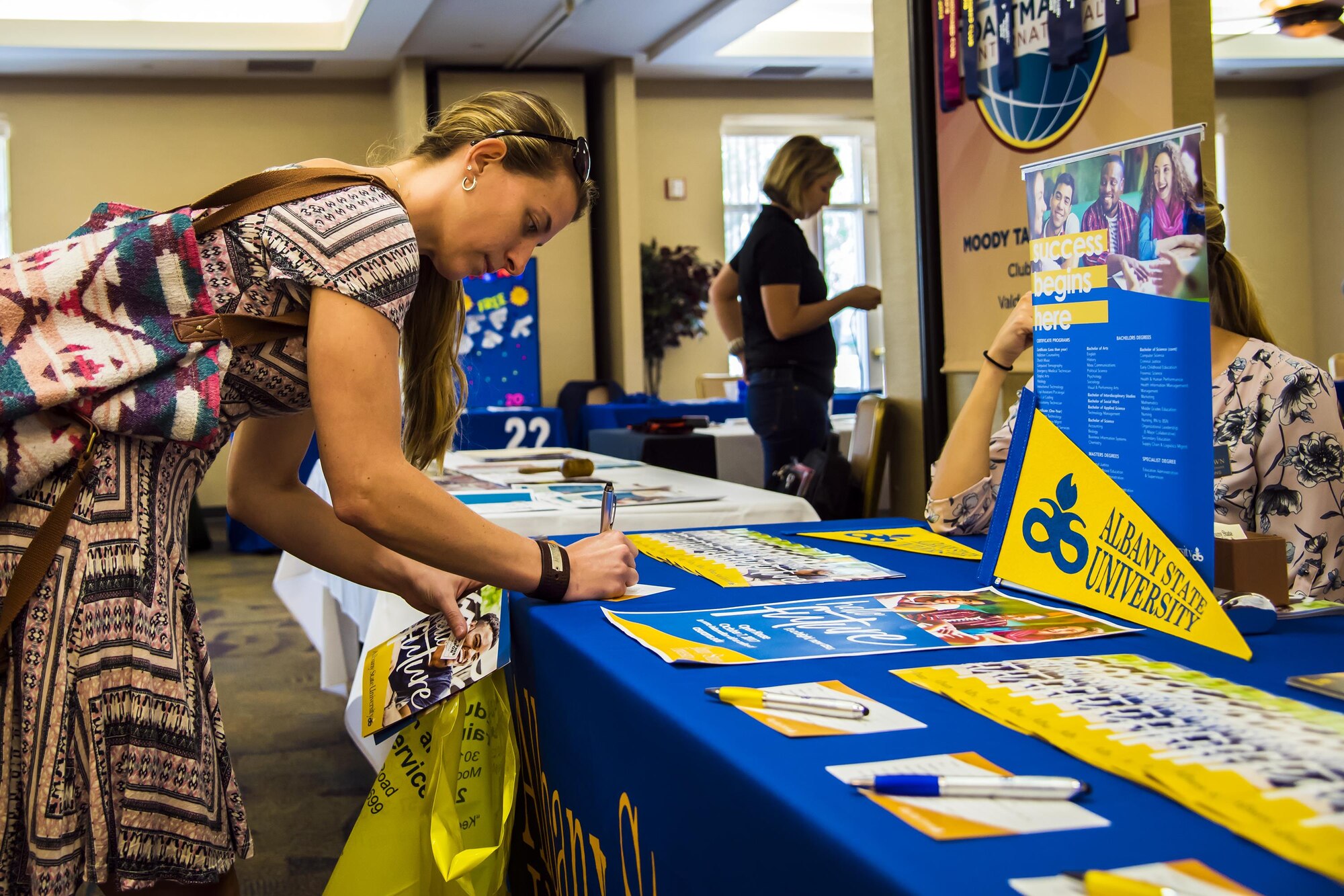Amanda Chambers, a local community member, fills out an information card during a National Education Fair, Oct. 3, 2017, at Moody Air Force Base, Ga. The event allowed Team Moody to learn about higher education opportunities that they have access to. (U.S. Air Force photo by Airman Eugene Oliver)