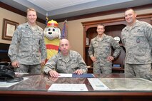 From left to right – Lt. Col. Alex Mignery, 341st Civil Engineer Squadron commander; Sparky the Fire Dog; Col. Ron Allen, 341st Missile Wing commander; Col. Marcus Glenn, 341st Mission Support Group commander; and Staff Sgt. Justin Bunton, 341st CES firefighter; officially recognize Fire Prevention Week as Oct. 7-13 at Malmstrom Air Force Base, Mont., with a signing of a proclamation Sept. 28, 2017. (U.S. Air Force photo/Airman 1st Class Daniel Brosam)