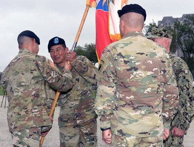 The passing of the colors is key to any change of command ceremony. U.S. Army South Command Sgt. Maj. Carlos Olvera passes the colors one final time to Maj. Gen. K.K. Chinn who relinquished command to the incoming Maj. Gen. Mark R. Stammer.