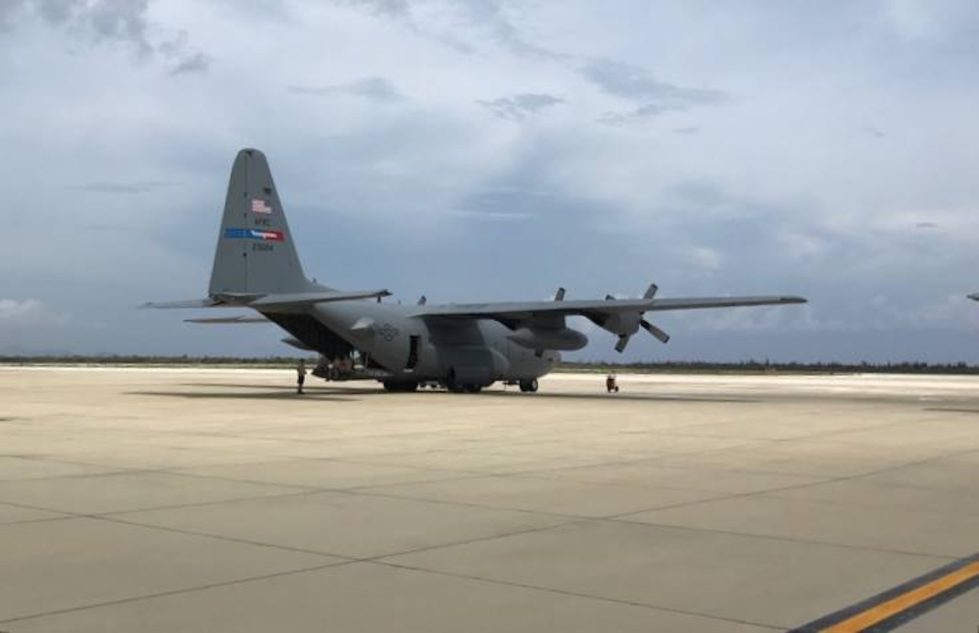 A 910th Airlift Wing C-130H Hercules aircraft sits on the ramp at Curacao International Airport.