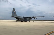 A 910th Airlift Wing C-130H Hercules aircraft sits on the ramp at Curacao International Airport.