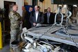 Major Gen. Patrick Reinert, left, commanding general, 88th Regional Support Command, listens as Launie Mashburn, shop supervisor for Area Maintenance Support Activity 61 (Ground), leads him on a tour of the facility. Prior to the tour, Reinert awarded the shop and its employees for earning runner up status in the Table of Distribution and Allowances (TDA) category of the U.S. Army Reserve Command’s Fiscal Year 2016 Army Award for Maintenance Excellence (AAME).