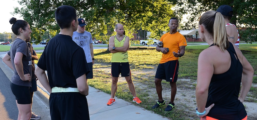 U.S. Army Lt. Col. Stephen Lockridge, U.S. Army Training and Doctrine Command budget director and Joint Base Langley-Eustis Army Ten-Miler team captain, gives a pep talk after a run at Fort Eustis, Va., Sept. 8, 2017.