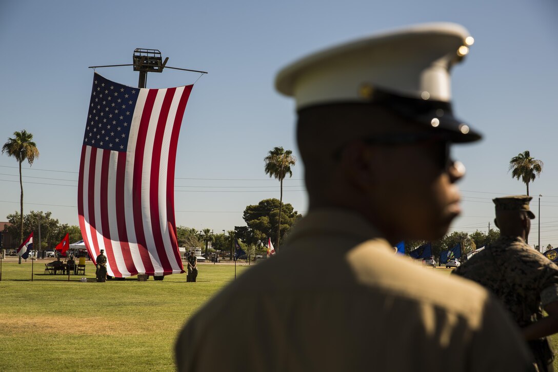 U.S. Marine Corps Cpl. Herman Nelson, a flight equipment technician with Marine Corps Air Station Yuma, Ariz., Search and Rescue Unit, narrates during the MCAS Yuma change of command ceremony held at the parade field Tuesday, June 27, 2017. During the ceremony, Col. Ricardo Martinez, the outgoing commanding officer, relinquished his command to Col. David A. Suggs, the oncoming commanding officer. (U.S. Marine Corps photo taken by Lance Cpl. Christian Cachola)