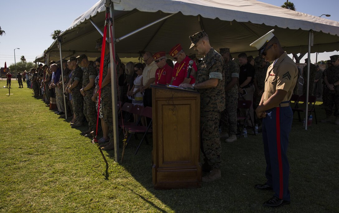 U.S. Navy Cmdr. David Slater, the Marine Corps Air Station Yuma, Ariz., command chaplain, gives the invocation during the MCAS Yuma change of command ceremony held at the parade field Tuesday, June 27, 2017. During the ceremony, Col. Ricardo Martinez, the outgoing commanding officer, relinquished his command to Col. David A. Suggs, the oncoming commanding officer. (U.S. Marine Corps photo taken by Lance Cpl. Christian Cachola)