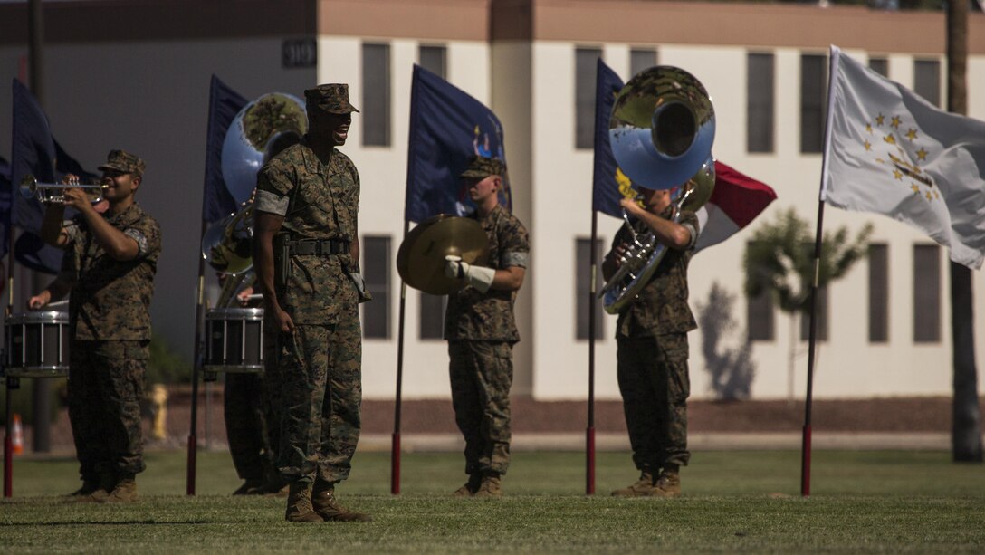 U.S. Marine Corps Capt. Herman Haynes, the Marine Corps Air Station Yuma, Ariz., station adjutant, calls troops to order during the MCAS Yuma change of command ceremony held at the parade field Tuesday, June 27, 2017. During the ceremony, Col. Ricardo Martinez, the outgoing commanding officer, relinquished his command to Col. David A. Suggs, the oncoming commanding officer. (U.S. Marine Corps photo taken by Lance Cpl. Christian Cachola)