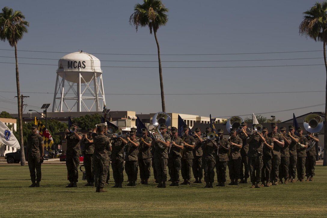 The U.S. Marine Corps 3rd Marine Aircraft Wing Band performs during the Marine Corps Air Station Yuma, Ariz., change of command ceremony held at the parade field Tuesday, June 27, 2017. During the ceremony, Col. Ricardo Martinez, the outgoing commanding officer, relinquished his command to Col. David A. Suggs, the oncoming commanding officer. (U.S. Marine Corps photo taken by Lance Cpl. Christian Cachola)