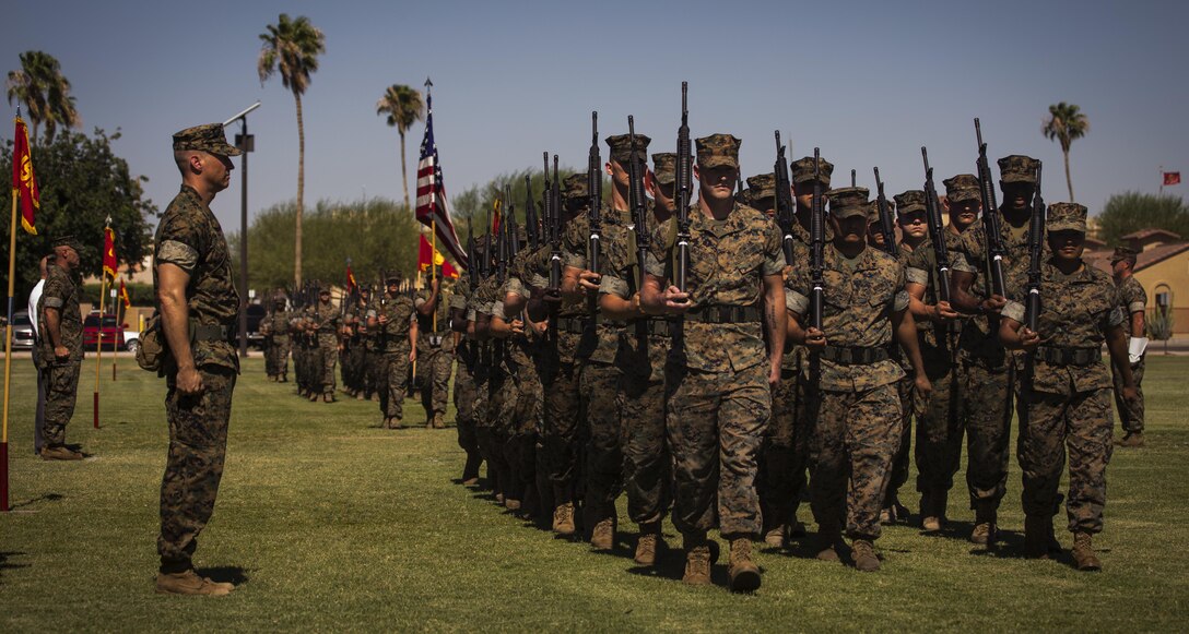 U.S. Marines complete the change of command ceremony with a pass in review during the Marine Corps Air Station Yuma, Ariz., change of command ceremony held at the parade field Tuesday, June 27, 2017. During the ceremony, Col. Ricardo Martinez, the outgoing commanding officer, relinquished his command to Col. David A. Suggs, the oncoming commanding officer. (U.S. Marine Corps photo taken by Lance Cpl. Christian Cachola)