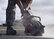 U.S. Air Force Staff Sgt. Trevor Harrison, 633rd Civil Engineer Squadron pavements and construction craftsman, cuts pavement with a power saw at Joint Base Langley-Eustis, Va., Sept. 25, 2017.