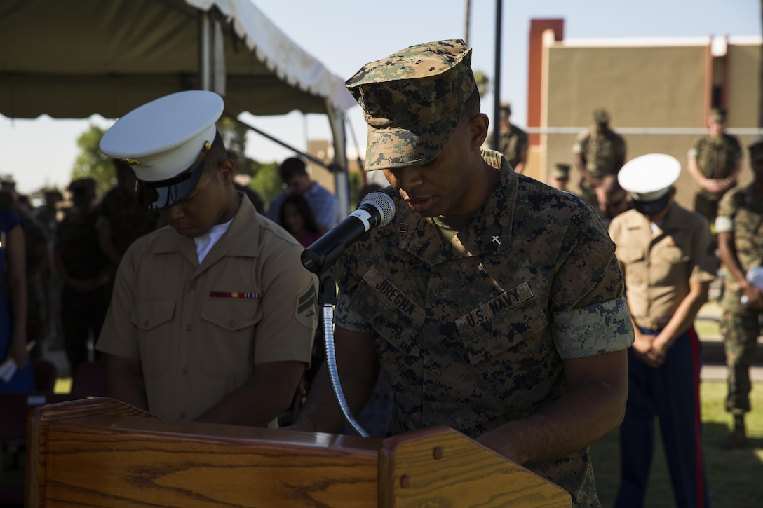 U.S. Navy Lt. Abraham Jiregna, a chaplain with Marine Corps Air Station (MCAS) Yuma, Ariz., gives the invocation during Sgt. Maj. Delvin R. Smythe's, the MCAS Yuma sergeant major, retirement ceremony, June 30, 2017. (U.S. Marine Corps photo taken by Lance Cpl. Christian Cachola)