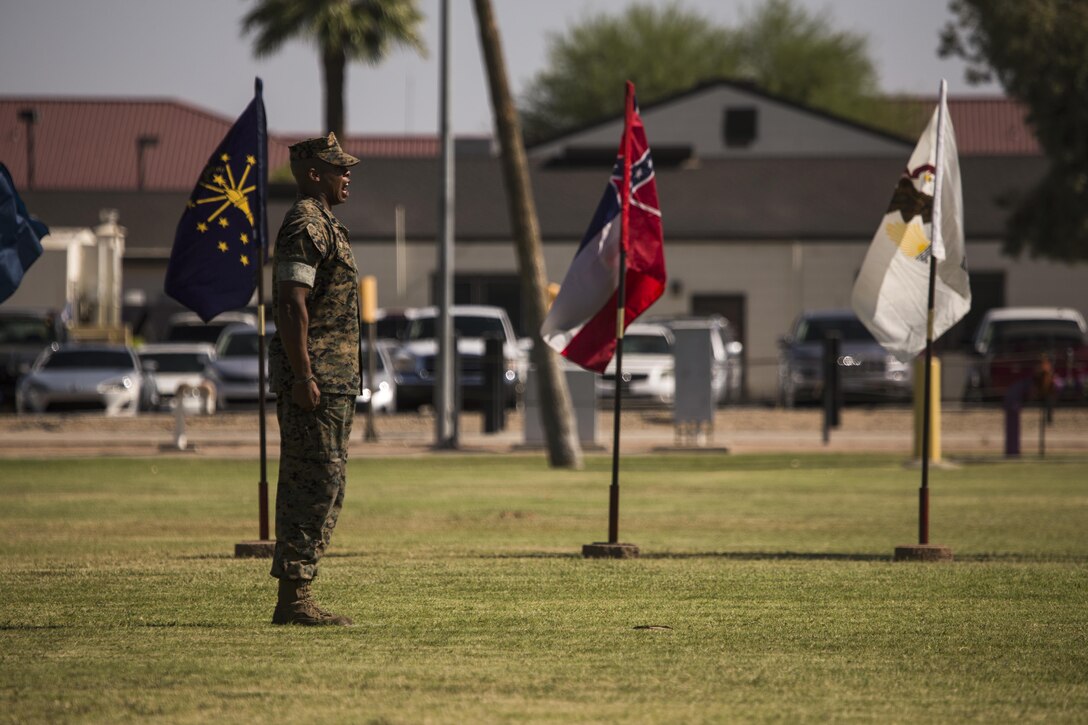 U.S. Marine Corps Staff Sgt. Matthew Bradley, the adjutant for the ceremony, calls troops to order during Sgt. Maj. Delvin R. Smythe's, the Marine Corps Air Station Yuma, Ariz., sergeant major, retirement ceremony, June 30, 2017. (U.S. Marine Corps photo taken by Lance Cpl. Christian Cachola)