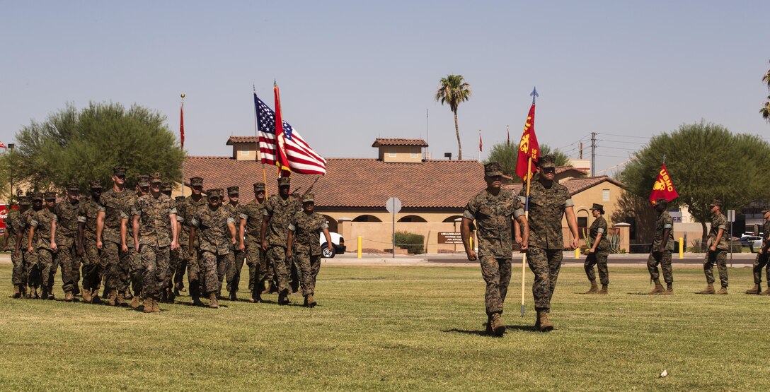 U.S. Marines with Marine Corps Air Station (MCAS) Yuma, Ariz., Headquarters and Headquarters Squadron conduct a pass in review during Sgt. Maj. Delvin R. Smythe's, the MCAS Yuma sergeant major, retirement ceremony, June 30, 2017. (U.S. Marine Corps photo taken by Lance Cpl. Christian Cachola)