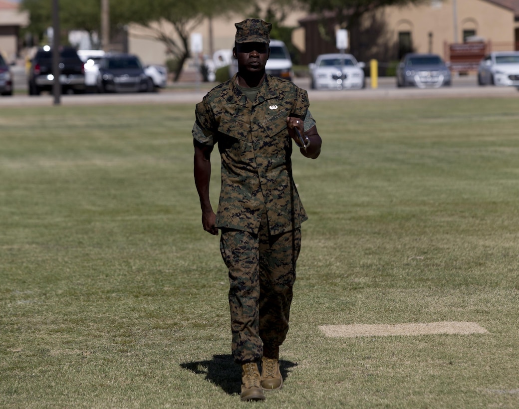 U.S. Marine Corps Sgt. Maj. Delvin R. Smythe, the Marine Corps Air Station (MCAS) Yuma, Ariz., segeant major, transfers the sword to Master Gunnery Sgt. Arthur Parra, who will serve as an acting sergeant major, during Sgt. Maj. Smythe's retirement ceremony, June 30, 2017. (U.S. Marine Corps photo taken by Lance Cpl. Joel Soriano)