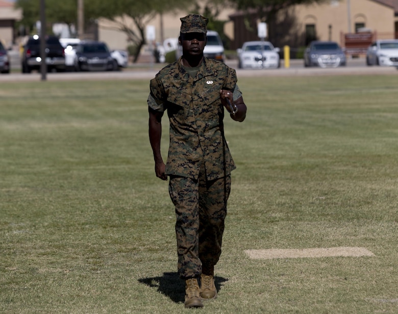 U.S. Marine Corps Sgt. Maj. Delvin R. Smythe, the Marine Corps Air Station (MCAS) Yuma, Ariz., segeant major, transfers the sword to Master Gunnery Sgt. Arthur Parra, who will serve as an acting sergeant major, during Sgt. Maj. Smythe's retirement ceremony, June 30, 2017. (U.S. Marine Corps photo taken by Lance Cpl. Joel Soriano)
