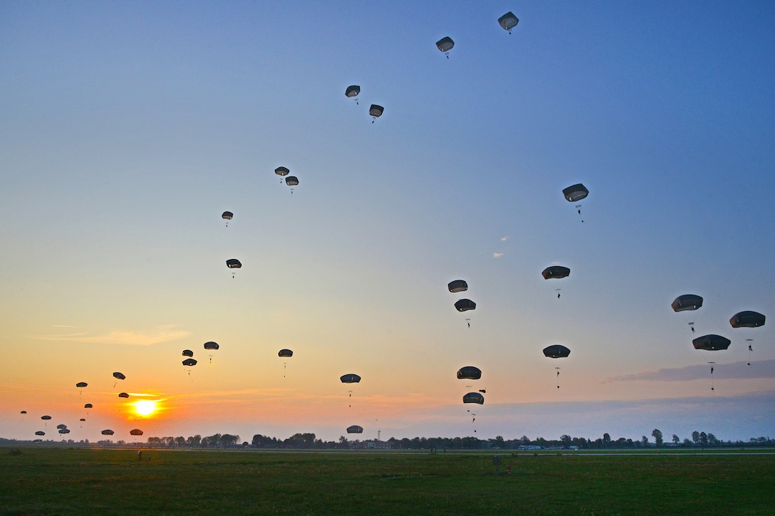 U.S. and Italian soldiers descend at Rivolto Air Base in Udine, Italy.