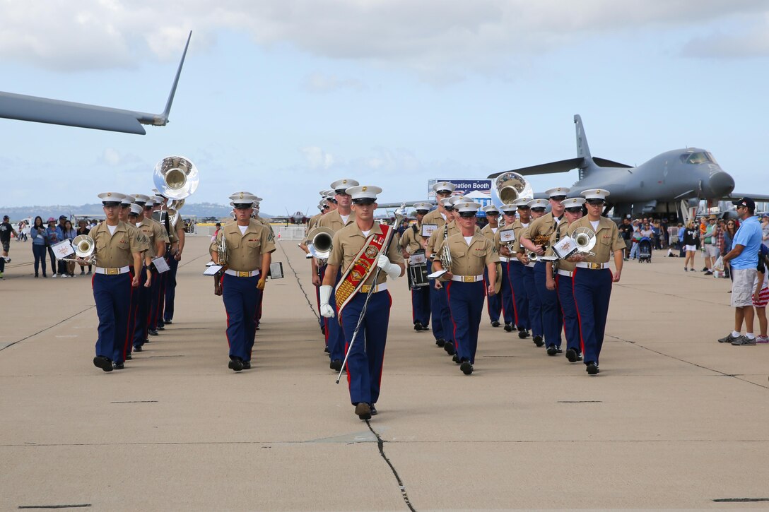 The 3rd Marine Aircraft Wing Band marches through the crowd during the 2017 Marine Corps Air Station Miramar Air Show at MCAS Miramar, Calif., Sept. 22. The band performed for the crowd while walking the flight line and during the opening ceremony. The theme for the air show is “A Salute to Vietnam Veterans” and features world-class civilian performers and displays recognizing the sacrifices of Vietnam veterans and celebrates our longstanding relationship with our neighbors in the local San Diego community. (U.S. Marine Corps photo by Sgt. Brytani Wheeler/Released)