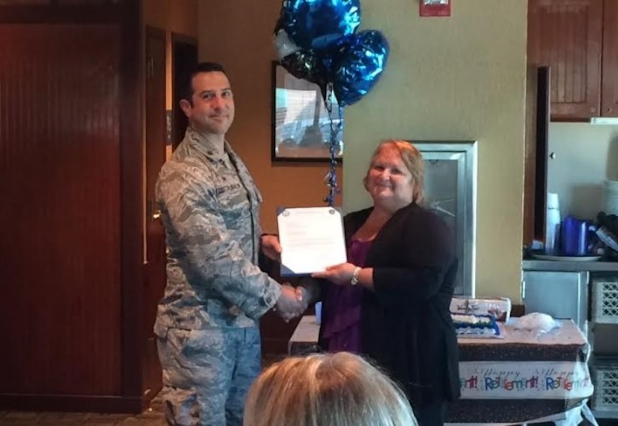 Alice Hoff celebrates her last day and retirement from the 375th Logistics Readiness Squadron.