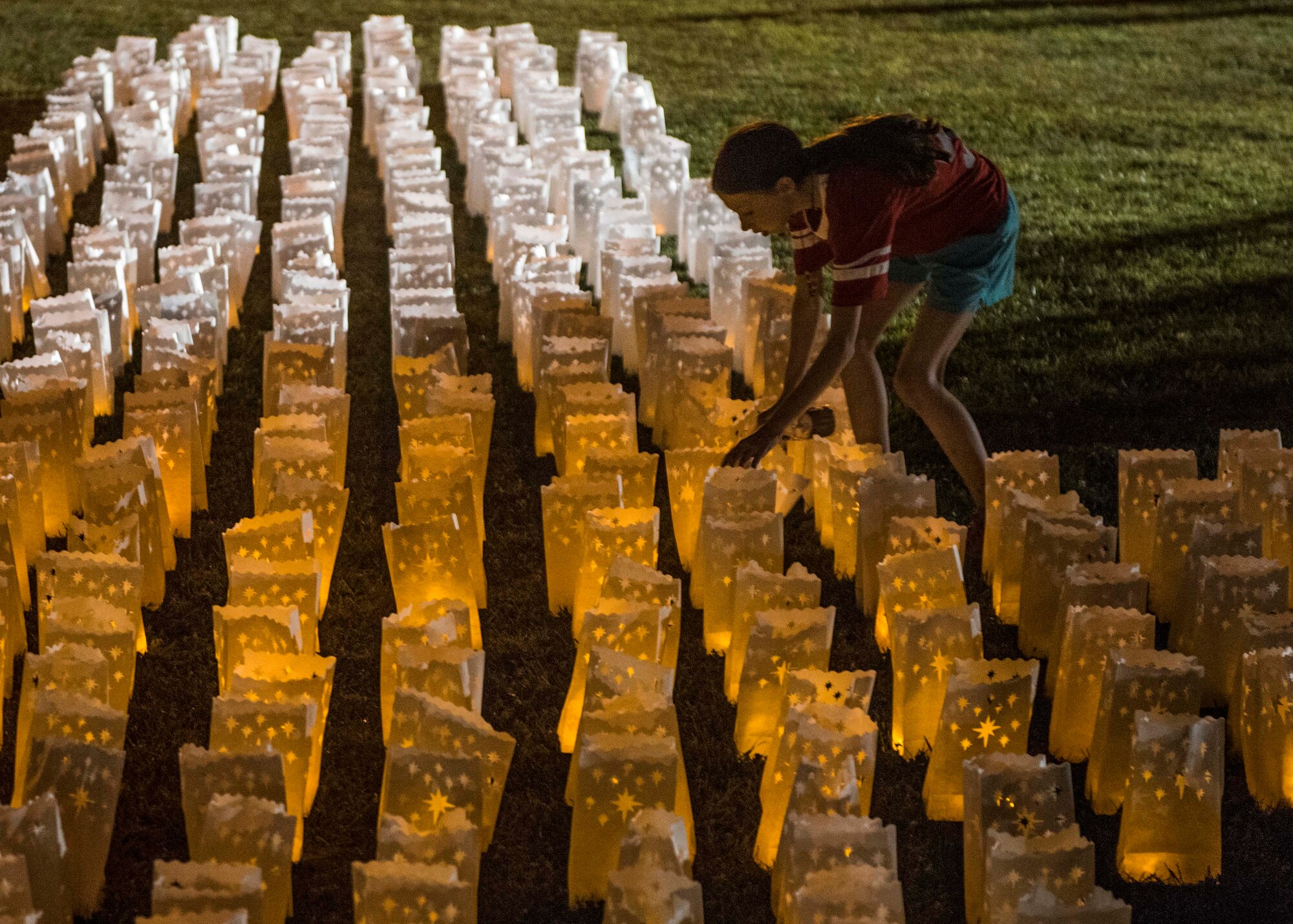 The fire department and over 500 community members came to the event, where over 700 luminaries, a wreath, and two posters with pictures of the family stretched across the Rock Spring Park, O’Fallon, Ill., Sept. 23, 2017.  (U.S. Air Force photo by Tech. Sgt. Jodi Martinez)