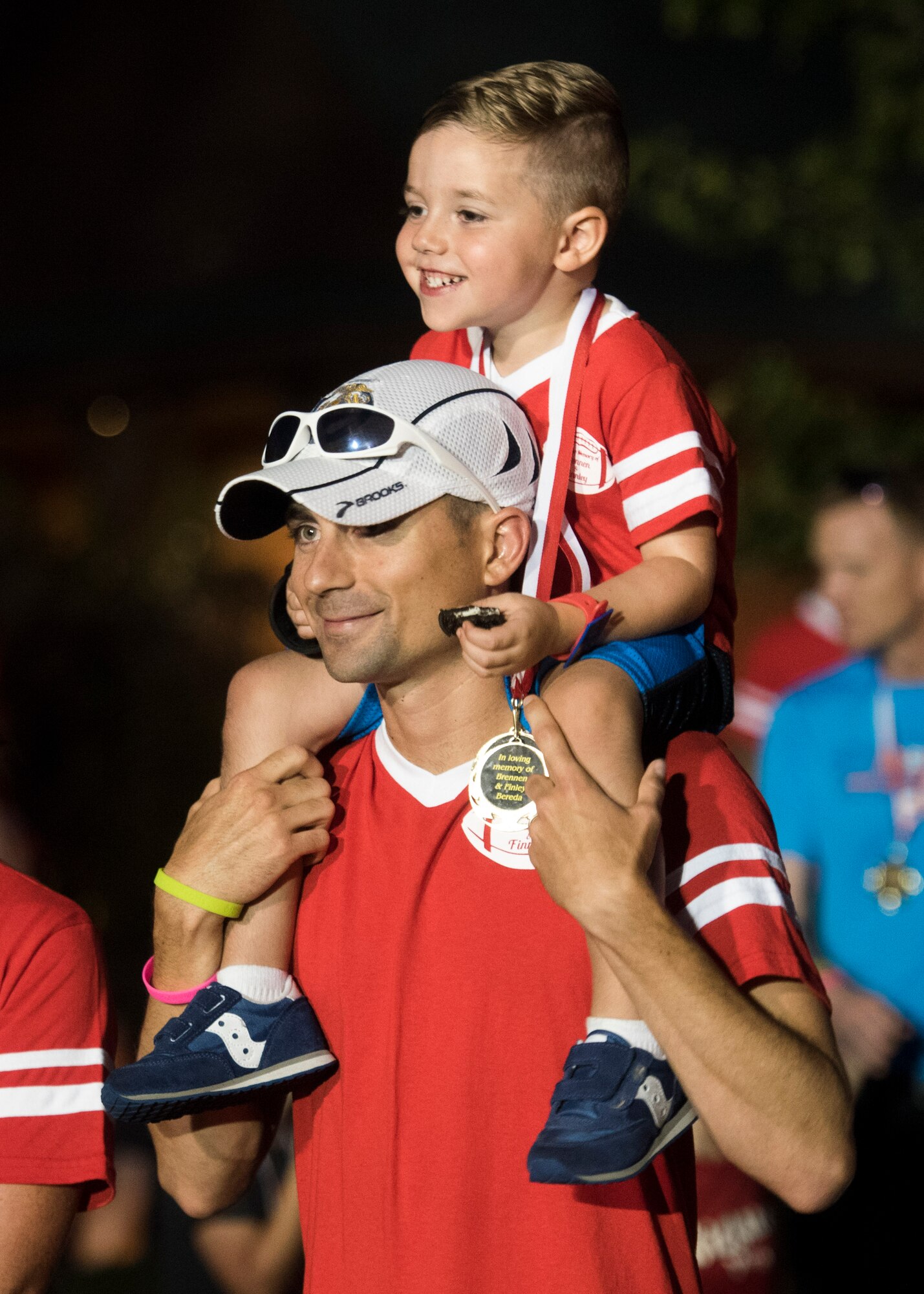 The fire department and over 500 community members came to the event, where over 700 luminaries, a wreath, and two posters with pictures of the family stretched across the Rock Spring Park, O’Fallon, Ill., Sept. 23, 2017.  (U.S. Air Force photo by Tech. Sgt. Jodi Martinez)