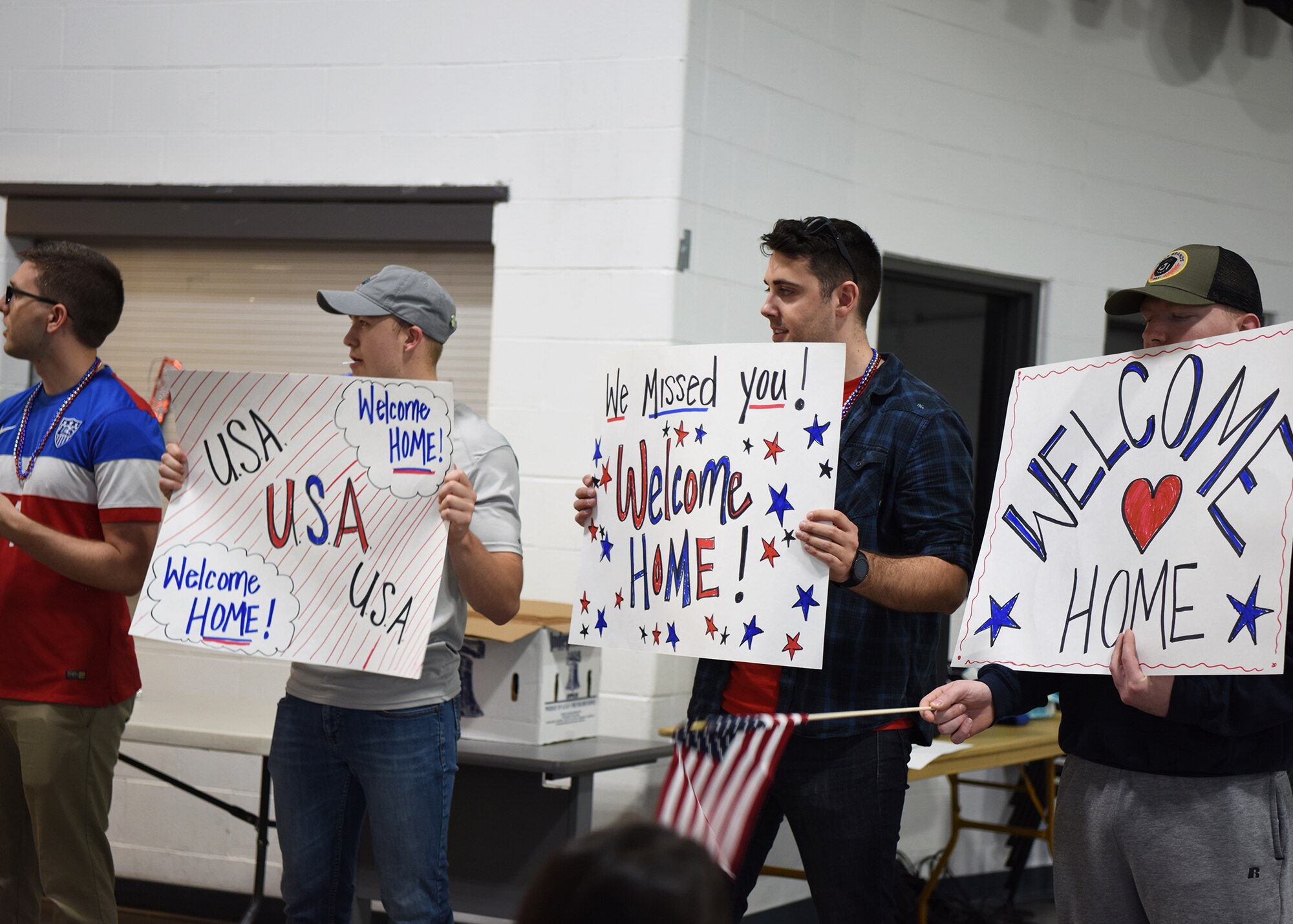 Volunteers and family members come out to “welcome children home” during a kid’s deployment day event Sept. 29, 2017, at Grand Forks Air Forces Base, North Dakota. The deployment day which was sponsored by the Network 5/6, featured activities such as a military working dog demo, obstacle course, combatives and more. (U.S. Air Force photo/Senior Airman Cierra Presentado)