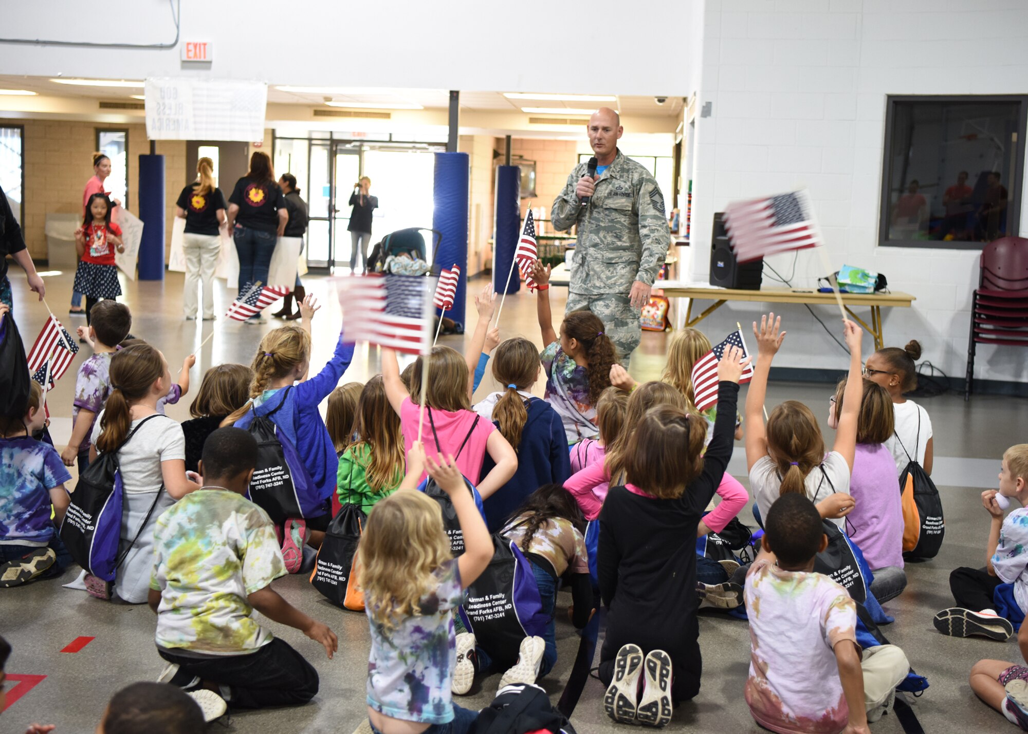 Chief Master Sgt. Terrence Stanich, 319th Mission Support Group superintendent, gives a speech at the end of the kid’s deployment day Sept. 29, 2017 at Grand Forks Air Force Base, North Dakota. The event was held to give children of military members the chance to experience what a deployment is like. (U.S. Air Force photo/Senior Airman Cierra Presentado)