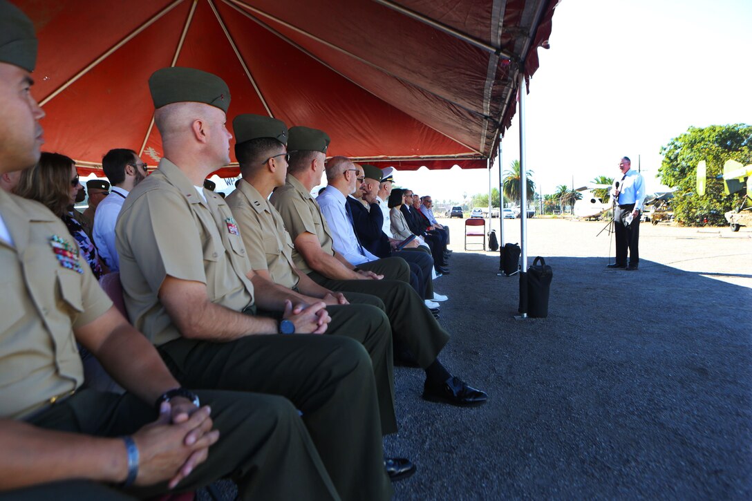Steve Wadase, the Space and Naval Warfare Systems Command (SPAWAR) central pacific joint tactical and air traffic control systems branch head, addresses the crowd gathered for The Flying Leatherneck Aviation Museum acceptance and induction ceremony for a TPN-22 and a TPS-73 radar system at Marine Corps Air Station Miramar, Calif., Sept. 28. Following an earlier retirement ceremony at MCAS Yuma, the TPN-22 and the TPS-73 radar systems were officially retired and put on display for museum visitors. Both radar systems were used for tracking and guiding aircraft in forward deployed scenarios when air traffic control towers were not available. (Marine Corps photo by Sgt. David Bickel/Released)