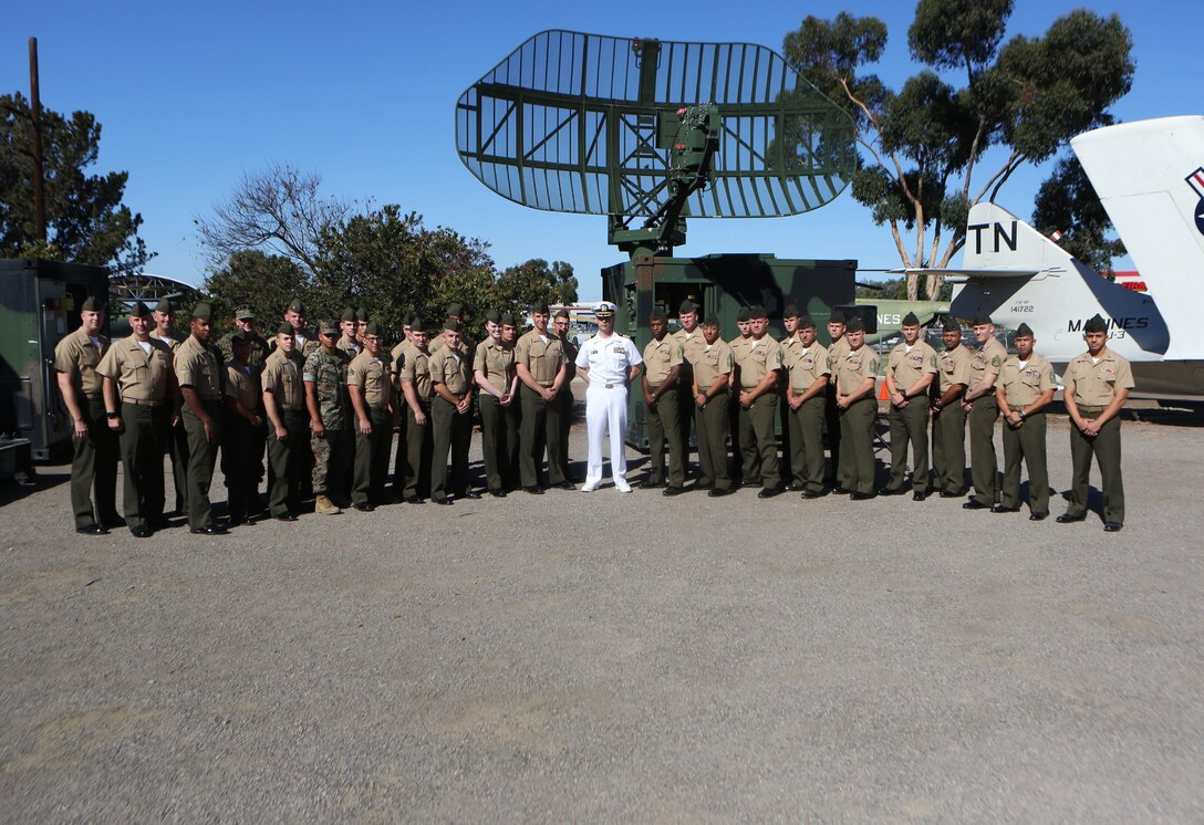 Active-duty Marines working in the air traffic control military occupational specialties give a final farewell before the TPN-22 and TPS-73 radar systems are inducted into the Flying Leatherneck Aviation Museum at Marine Corps Air Station Miramar, Calif., Sept. 28. Following an earlier retirement ceremony at MCAS Yuma, the TPN-22 and the TPS-73 radar systems were officially retired and put on display for museum visitors to enjoy. Both radar systems were used for tracking and guiding aircraft in forward deployed scenarios when air traffic control towers were not available. (Marine Corps photo by Sgt. David Bickel/Released)