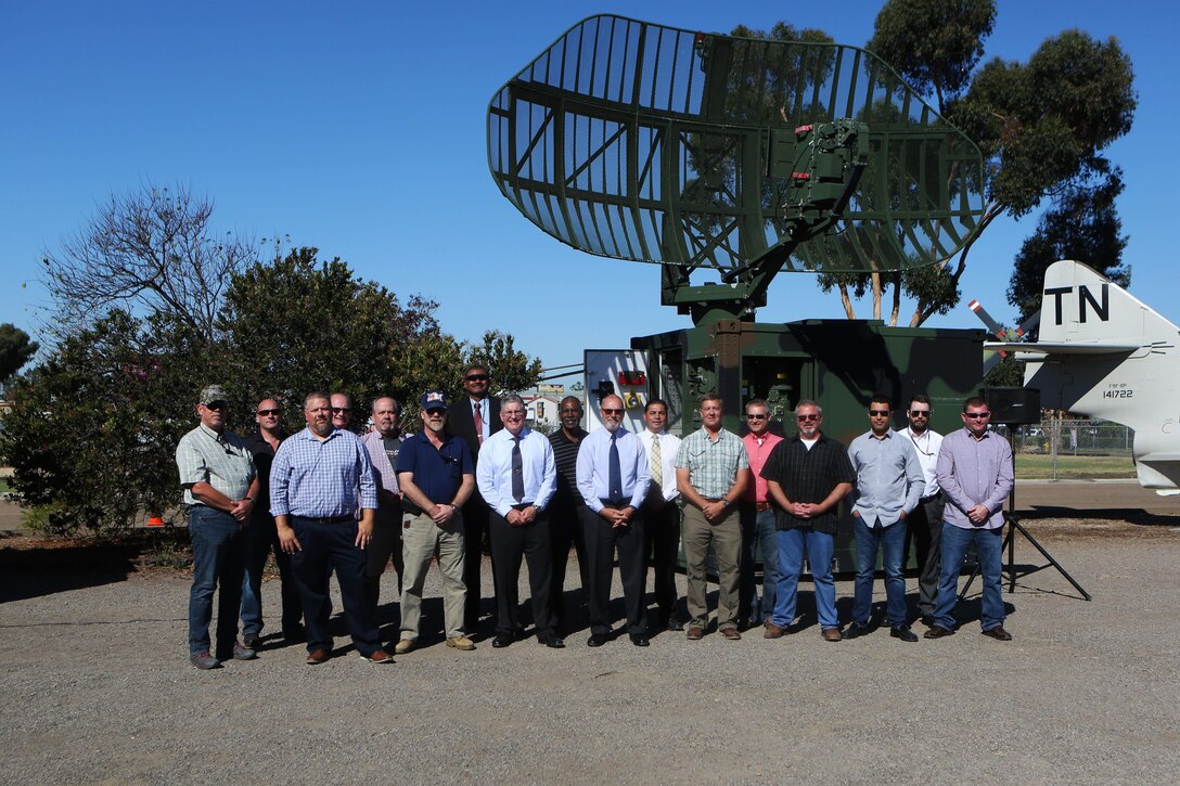 Retired Marines, who employed the TPN-22 and TPS-73 radar systems, give a final farewell before the systems are inducted into the Flying Leatherneck Aviation Museum at Marine Corps Air Station Miramar, Calif., Sept. 28. Following an earlier retirement ceremony at MCAS Yuma, the TPN-22 and the TPS-73 radar systems were officially retired and put on display for museum visitors to enjoy. Both radar systems were used for tracking and guiding aircraft in forward deployed scenarios when air traffic control towers were not available. (Marine Corps photo by Sgt. David Bickel/Released)