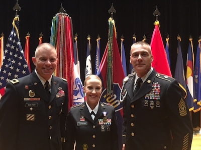 (Left to right) Brig. Gen. Aaron Walter, 100th Training Division commander, Sgt. 1st Class Alicia Hofmann, and Command Sgt. Maj. Andrew Lombardo, command sergeant major for the 100th TD, pose for photographs at Hofmann's award ceremony held at Fort Knox, Kentucky, Sept. 29, 2017. Assigned to the 8th Regiment, 100th Health Services Battalion, 4th Brigade, 100th Training Division, Hofmann was awarded the Soldier's Medal for risking her life to save a man from a car accident that occurred on Oct. 4, 2014 in Saline, Michigan. (Photo by Sgt. 1st Class Nang Cash, 100th Training Division Operations NCOIC)