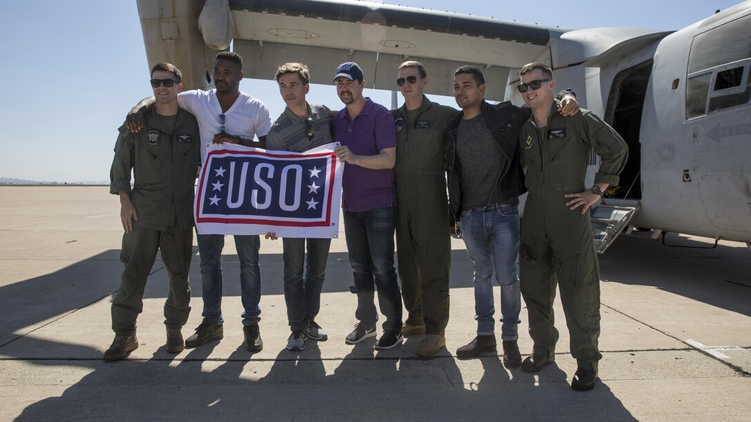 Leading cast members of the CBS hit drama “NCIS: Naval Criminal Investigations,” take photos with Marines during a USO tour at Marine Corps Air Station Miramar, Calif., Sept. 30. Leading cast members from the hit CBS drama “NCIS: Naval Criminal Investigations,” Brian Dietzen, Duane Henry, Sean Murray and Wilmer Valderrama viewed three different aircraft platforms with 3rd Marine Aircraft Wing and attended a luncheon with Marines prior to a question-and-answer session and show screening. (U.S. Marine Corps photo by Sgt. Lillian Stephens/Released)