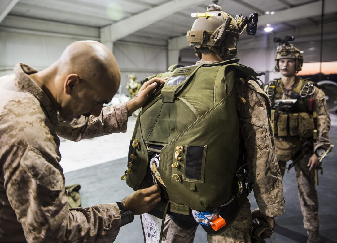 Marines with the Force Reconnaissance Company, III Marine Expeditionary Force stationed at Camp Schwab in Okinawa, Japan run though Jumpmaster Parachute Inspections (JMPIs) at IDIS-Corps facility in Parker, Ariz., from July 12 to Aug 1, 2017. The Marines conducted high altitude high opening (HAHO) sustainment training, while implementing the Joint Precision Air Drop System (JPADS).  During JMPIs, the jumpmaster checks the jumpers oxygen mask is properly working and checks  gear and ensures everything is in position and ready for the parachute’s release.