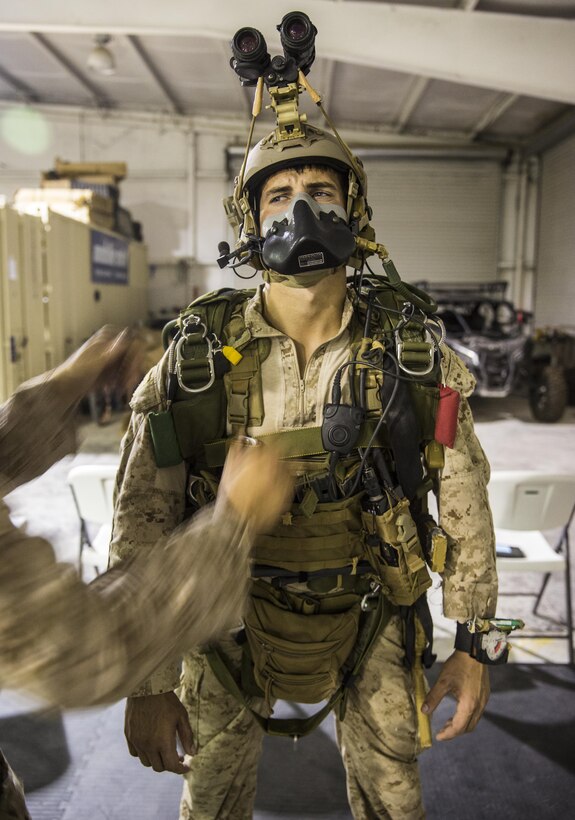 Marines with the Force Reconnaissance Company, III Marine Expeditionary Force stationed at Camp Schwab in Okinawa, Japan run though their Jump Master Parachute Inspections (JMPIs) at IDIS-Corps facility in Parker, Ariz., from July 12 to August 1, 2017. The Marines conducted high altitude high opening (HAHO) sustainment training, while implementing the Joint Precision Air Drop System (JPADS).   During JMPIs, the jumpmaster checks the jumpers oxygen mask is properly working and checks  gear and ensures everything is in position and ready for the parachute’s release.