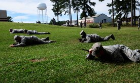Joint Base Charleston Airmen practice low crawling during a modified version of Warfighter Skills Training at McCrady Army National Guard Training Center, S.C., Sept. 25, 2017.