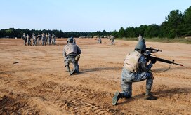 Joint Base Charleston Airmen practice low crawling during a modified version of Warfighter Skills Training at McCrady Army National Guard Training Center, S.C., Sept. 25, 2017.