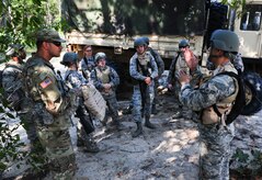 Joint Base Charleston Airmen discuss the overall basic combat skills training with Army instructors during the final day of Warfighter Skills Training at McCrady Army National Guard Training Center, S.C., Sept. 29, 2017.