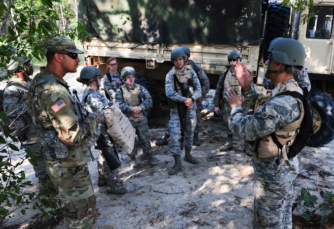 Joint Base Charleston Airmen discuss the overall basic combat skills training with Army instructors during the final day of Warfighter Skills Training at McCrady Army National Guard Training Center, S.C., Sept. 29, 2017.