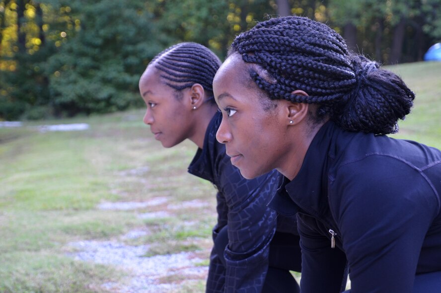 Shaina Williams, foreground, and Shannon Barber, 94th Airlift Wing development and training flight trainees, prepare to run at the base track at Dobbins Air Reserve Base, Ga. Sept. 10, 2017. Both sisters ran track and field at Georgia State University before enlisting in the Air Force Reserve. (U.S. Air Force photo/Senior Airman Lauren Douglas)