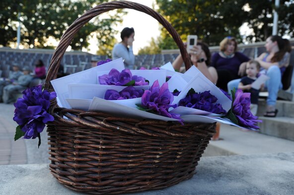 Cards with the names of those in Texas who died from domestic violence were passed out with purple flowers at the domestic violence awareness event on Laughlin Air Force Base, Texas, Oct. 2, 2017. According to Casey Molleson, 47th Medical Operations Squadron family advocacy outreach manager, in 2015, the state of Texas saw 157 fatalities due to domestic violence.