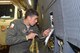 Senior Airmen Antonio Farias, 433rd Aircraft Maintenance Squadron crew chief, fixes an exterior light on a C-5M Super Galaxy, operated by Air Force Reserve Citizen Airmen with the 433rd Airlift Wing in Colorado Springs, Colorado.  Farias was part of an aircrew taking Soldiers from the 247th Composite Supply Company, 68th Sustainment Support Battalion, 4th Sustainment Brigade, 4th Infantry Division, supplies, fuel trucks and a communications vehicle to be employed in relief efforts in Puerto Rico after Hurricane Maria struck the commonwealth with Category 4 winds. (U.S.  Air Force photo by Tech. Sgt. Carlos J. Treviño)