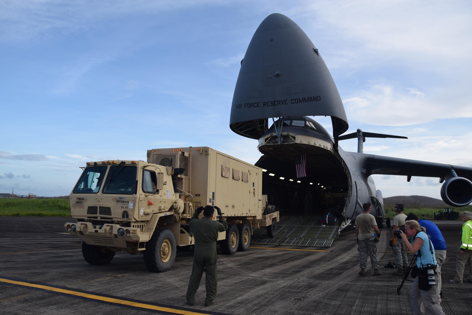 A Joint Incident Site Communications Capability (JISCC) vehicle is unloaded from an Air Force Reserve Command’s 433rd Airlift Wing C-5M Super Galaxy at Ceiba, Puerto Rico Oct. 1, 2017. The C-5M, flown by Reserve Citizen Airmen from Joint Base San Antonio-Lackland, Texas, took the JISCC, 11 Soldiers,  supplies and two fuel trucks to Puerto Rico to aid hurricane recovery efforts that have affected the United States and its territories  in the Caribbean. (U.S.  Air Force photo by Tech. Sgt. Carlos J. Treviño)