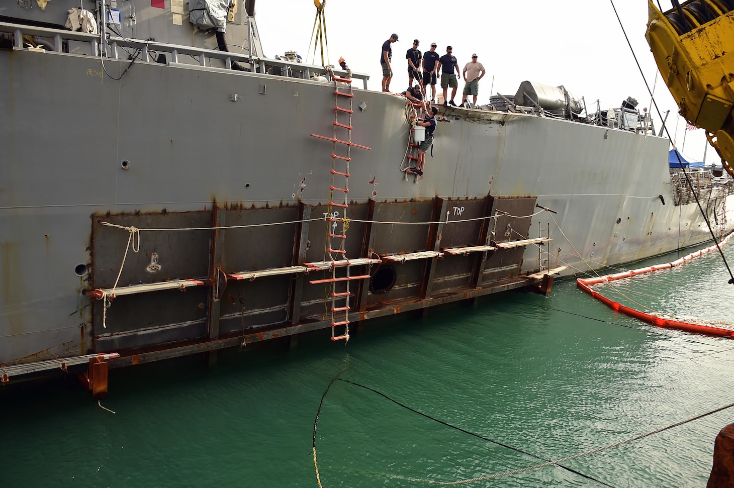 CHANGI NAVAL BASE, Singapore (September 21, 2017) A temporary patch has been welded to the collision site aboard USS John S. McCain (DDG 56).  Significant damage to the hull resulted in flooding to nearby compartments, including crew berthing, machinery, and communications rooms as a result of a collision with the merchant vessel Alnic MC while underway east of the Straits of Malacca and Singapore on Aug. 21.