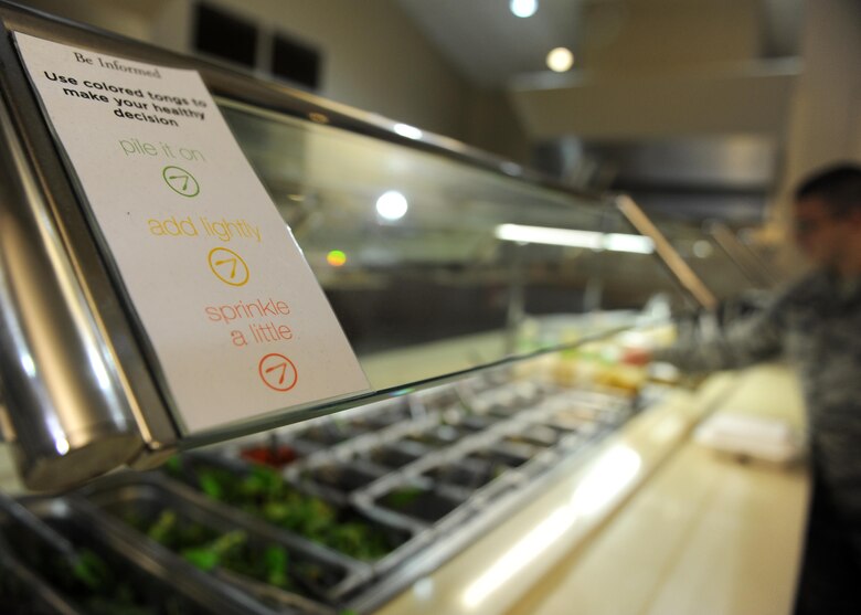 A placard designed for the Department of Defense's Go for Green program is used to make healthy choices Oct. 3, 2017, at the Hercules Dining Facility on Little Rock Air Force Base, Ark. To improve the effectiveness of the Go for Green program, the Air Force Medical Support Agency health promotions team has employed an updated version of the Military Nutrition Environment Assessment Tool, or m-NEAT 2.0, to assess an installation’s nutrition environment and policies related to promoting and supporting healthy among Airmen. The tool looks at food policy, availability, choice architecture, health messaging and food labeling, and economics and community outreach. The goal of this assessment is to help develop targeted interventions and allow Airmen to make healthy choices. (U.S. Air Force photo by Airman 1st Class Grace Nichols)