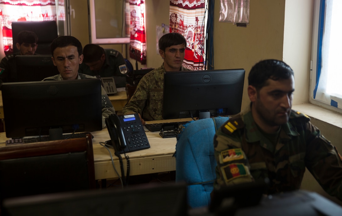 Afghan National Defense and Security Force policemen from various units conduct daily tasks at the Operational Coordination Center – Regional at Bost Airfield, Afghanistan, Oct. 2, 2017. One of the primary missions of the OCC-R is to maintain situational awareness with operational forces on the ground and provide information to ground commanders so they can manage their forces and resources effectively. (U.S. Marine Corps photo by Sgt. Justin T. Updegraff)