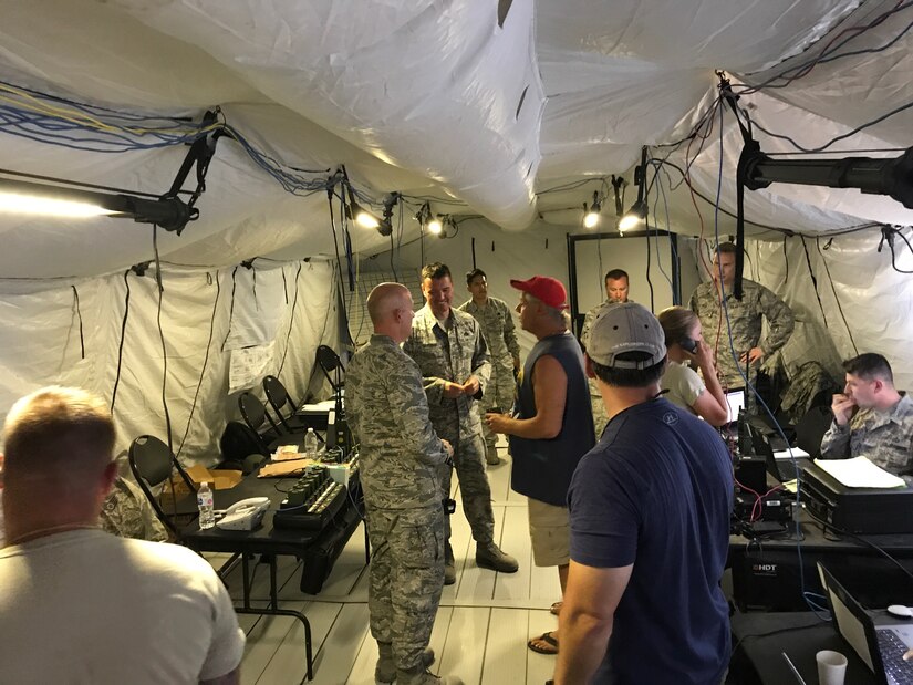 Shane Brunner, center, thanks military members for ensuring he was safe after Hurricane Irma hit his local area in Marathon, Florida, Sept. 14, 2017