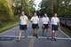 Airmen from the 820th Base Defense Group smile while crossing the finish line of a Violence Prevention Awareness 5K, Oct. 4, 2017, at Moody Air Force Base, Ga. Moody leadership proclaimed October as Violence Prevention Awareness Month in order to recognize and educate Airmen and families about suicide prevention, drug abuse, stalking awareness and domestic violence prevention. (U.S. Air Force photo by Airman 1st Class Erick Requadt)
