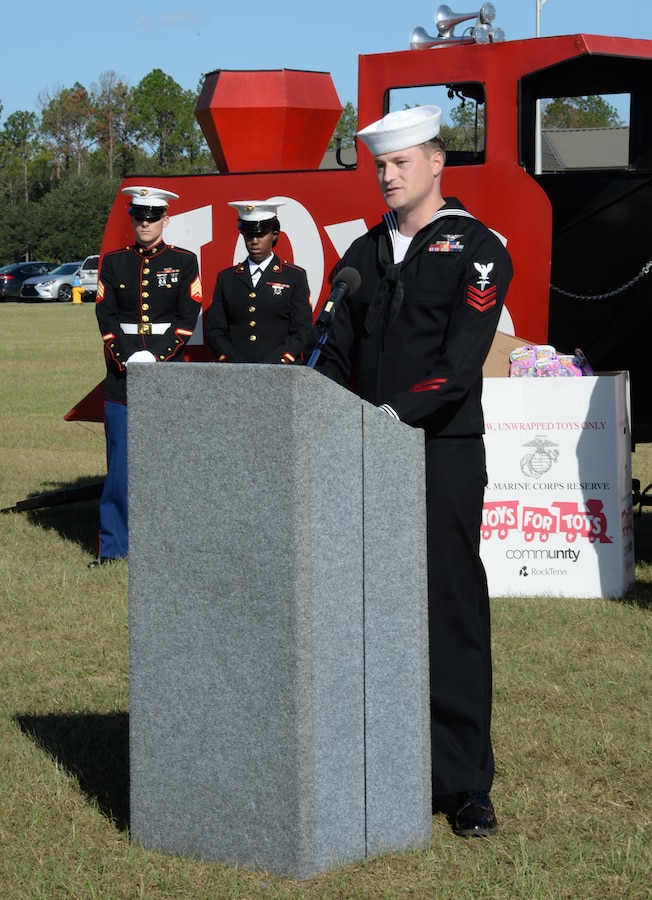 Petty Officer 1st Class Taylor Cossins, coordinator, Toys for Tots, kicks off the annual Toys For Tots campaign to collect new, unwrapped toys for less fortunate children in the local community, aboard Marine Corps Logistics Base Albany, Oct. 4.