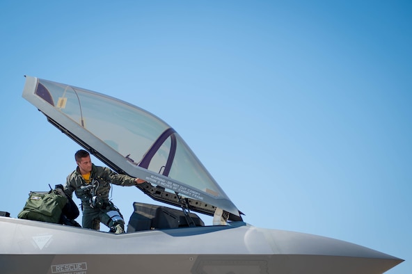 F-35 student pilot, climbs into an F-35 Lighting II
